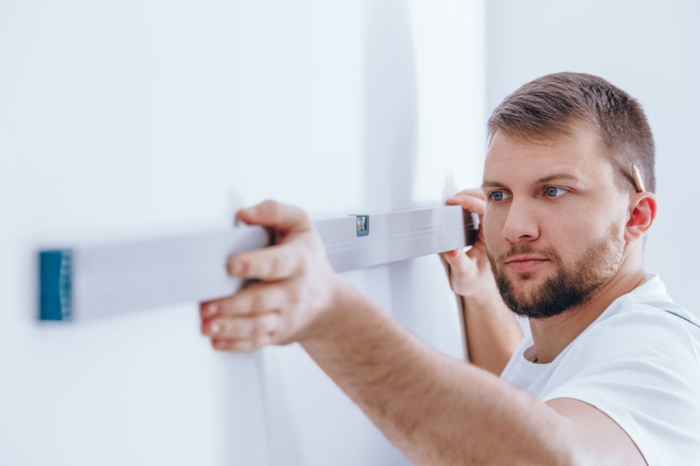 worker checking the wall panffwc 1.jpg